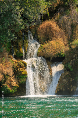 Fototapeta Naklejka Na Ścianę i Meble -  View of waterfall cascade on a sunny day in Krka National Park, Croatia