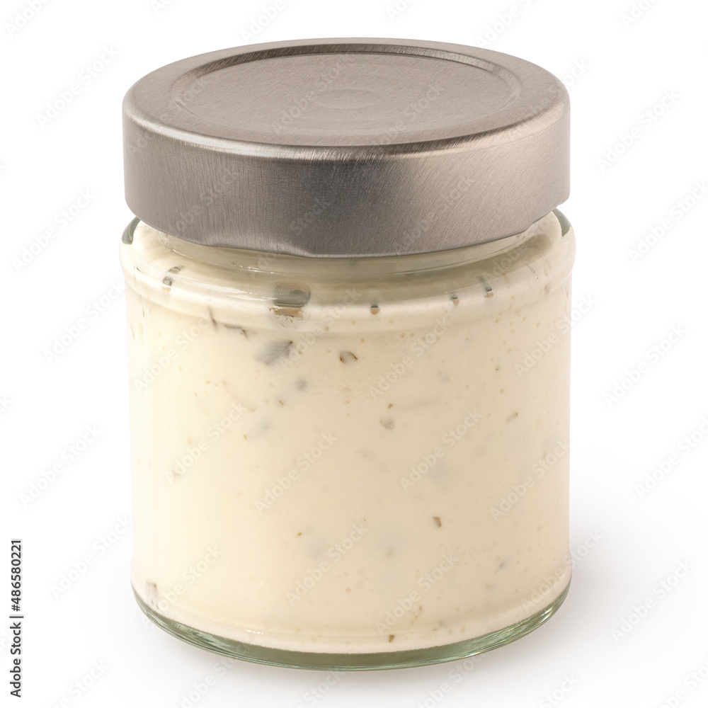 Yoghurt and garlic sauce in a jar isolated. Yoghurt and garlic sauce in a jar isolated.
