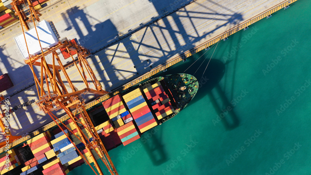 Container Loading Go Down Aerial top down photo of cranes loading - unloading container ship ...