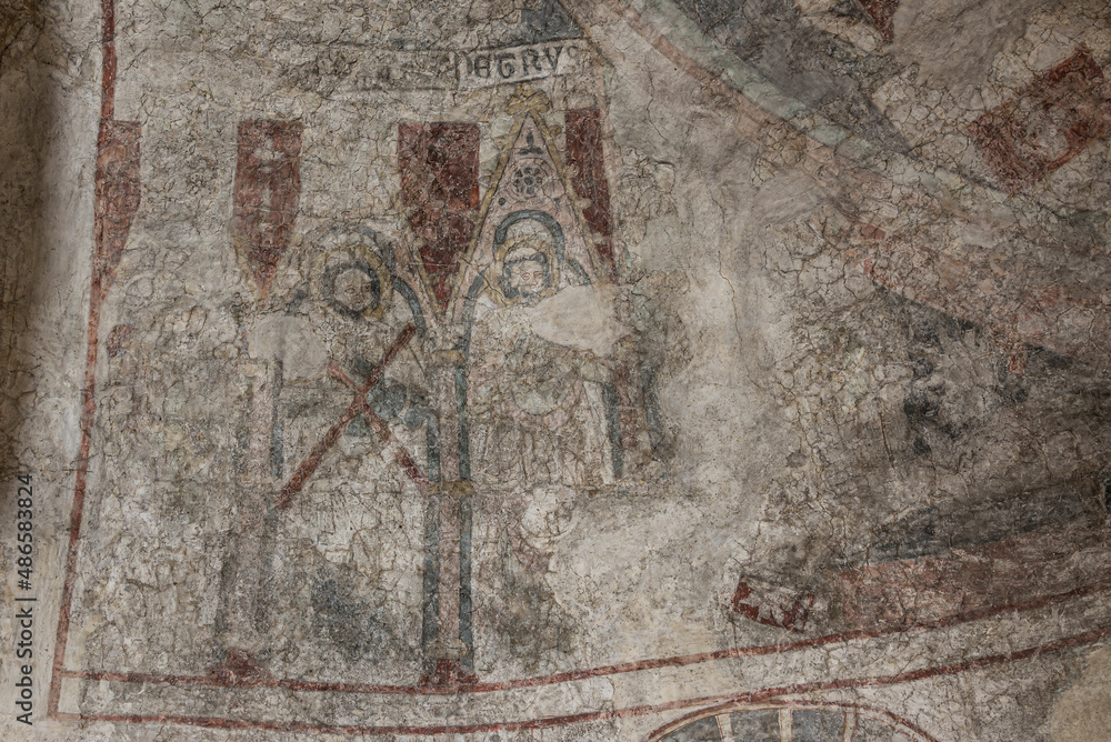 Obraz premium The apostles Peter and Andrew on an ancient medieval mural in the apse of the Church in Skurup