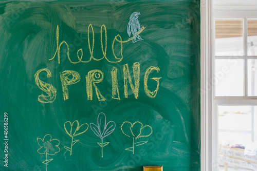 Hello Spring Written on Chalkboard at home