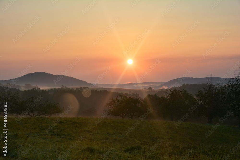 Morning mood at sunrise, hilly green nature with fog Morning mood at sunrise, hilly green nature with fog