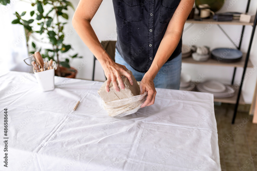 Anonymous Woman Preparing Clay For Work Anonymous Woman Preparing Clay For Work