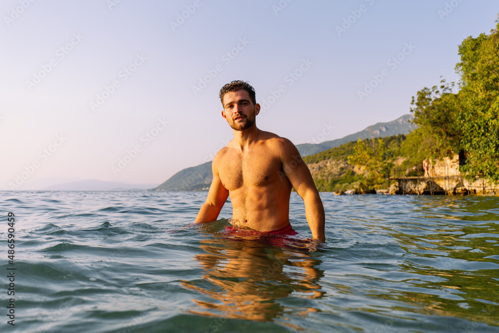 Portrait of a handsome young man in water Portrait of a handsome young man in water