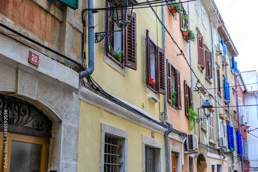 shutters of all colors represent the mediterranean flair of Piran, Slovenia