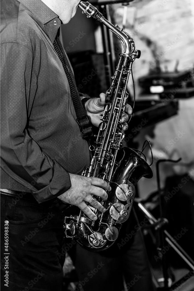 Fototapeta premium man playing saxophone