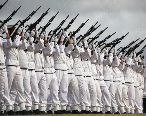 Sailors fire their guns ceremonially photo