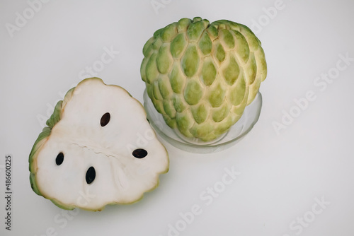 Cherimoya sugar apple eshta fruit cut with black seeds, exotic sweet food in Egypt photo