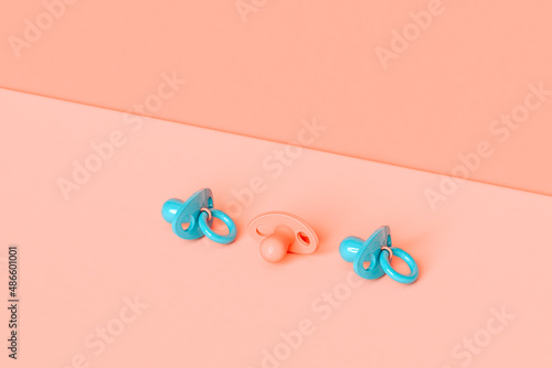 pacifier in pastel colors with copy space photo