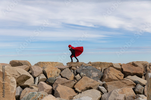 Fall fashion Girl in elegant Red cape Coat on Seawall photo