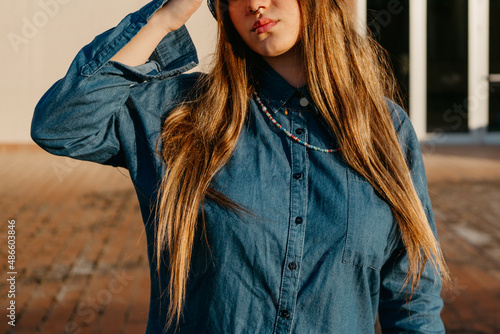 Stylish college girl outside building photo