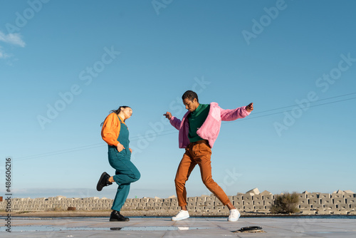 Cool friends listening to music and dancing