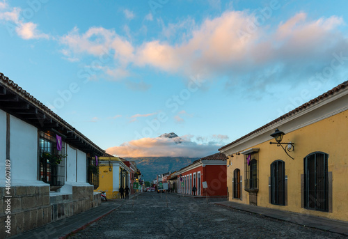 Antigua city street at sunrise with Agua volcano, Guatemala.