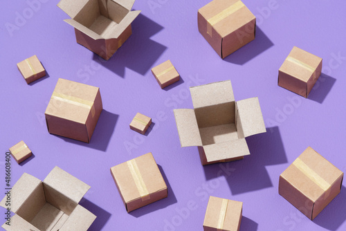 Lot of cardboard boxes on purple background