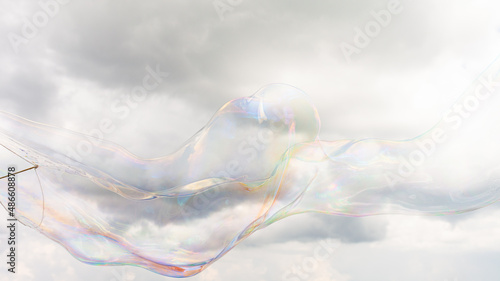 A giant bubble against a cloudy sky