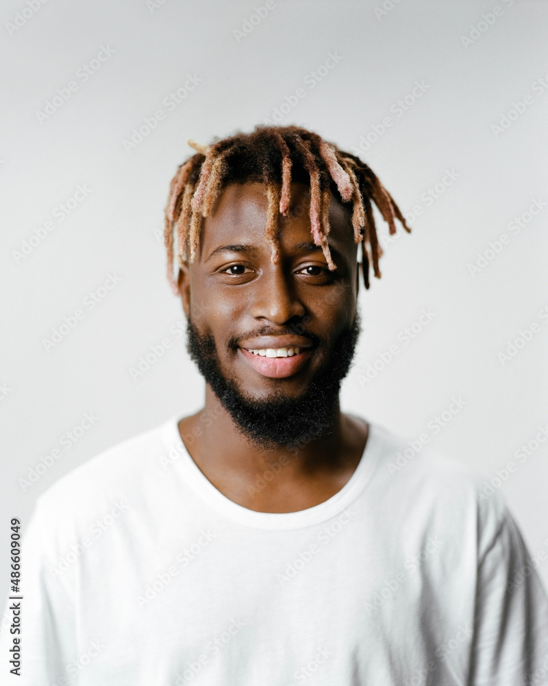 Portrait of a smiling man with dreadlocks Portrait of a smiling man with dreadlocks