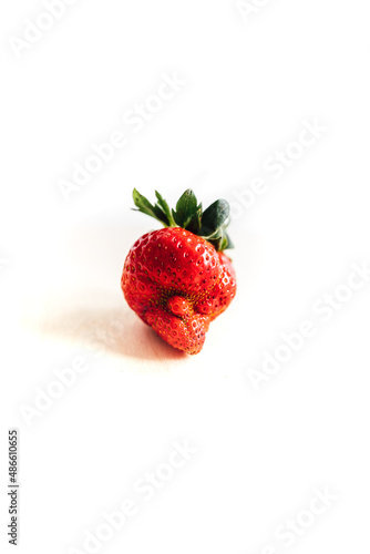 imperfect, misshapen strawberry  photo