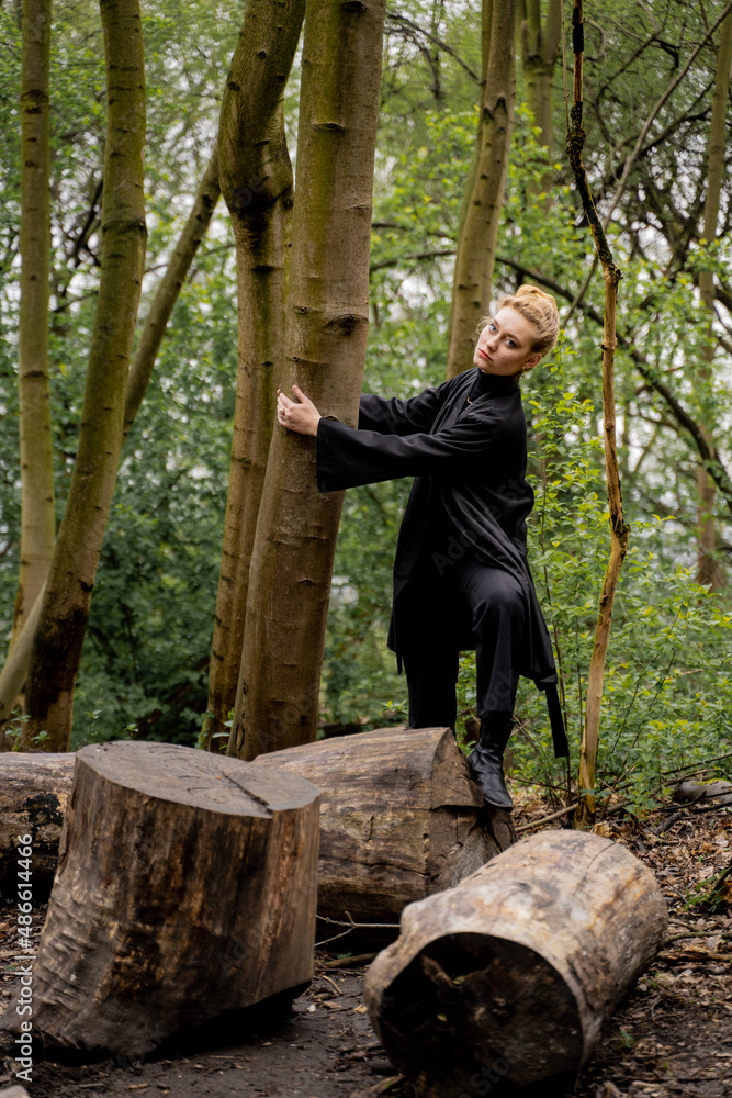 Woman Embracing Tree In Forest Woman Embracing Tree In Forest