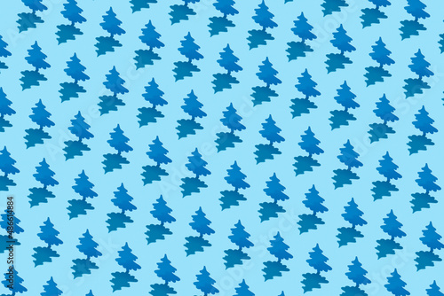 Seamless pattern of blue fir trees photo