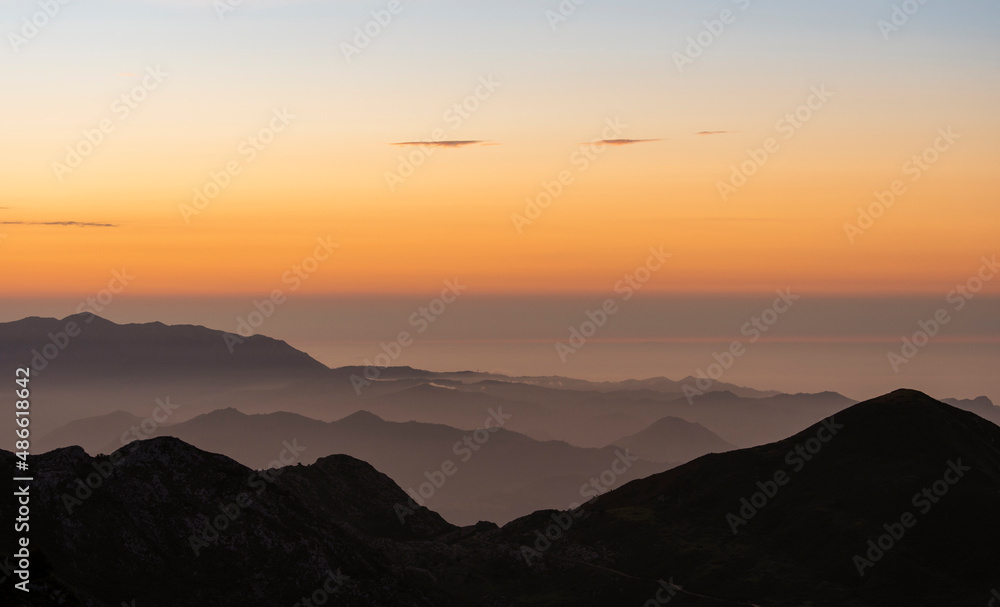 views of a mountain range at sunrise views of a mountain range at sunrise