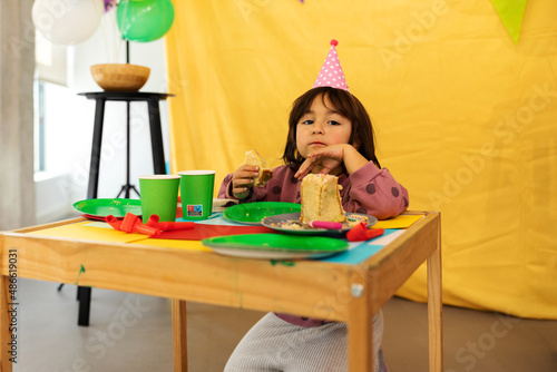 Birthday girl taking cake alone