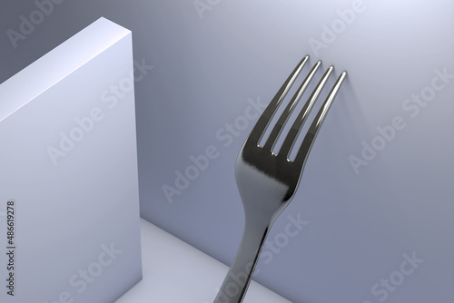 Metal fork leaning against the wall photo