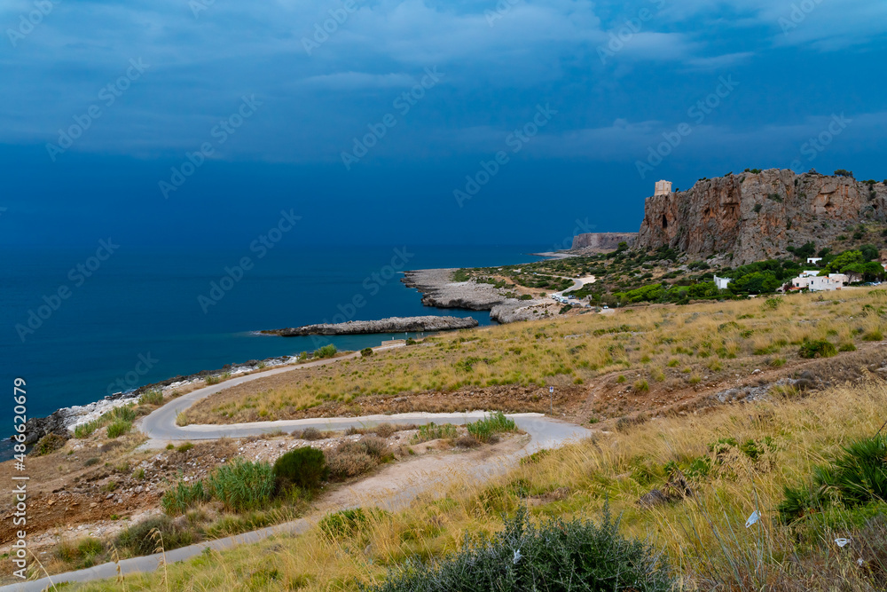 Road along a natural park in Sicily, Italy Road along a natural park in Sicily, Italy