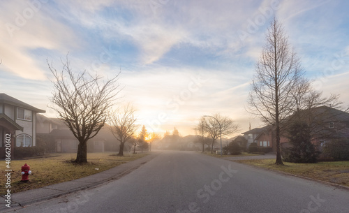 Fraser Heights, Surrey, Greater Vancouver, BC, Canada. Beautiful Street view in the Residential Neighborhood during a colorful Winter Season. Dramatic Sunrise Sky. © edb3_16