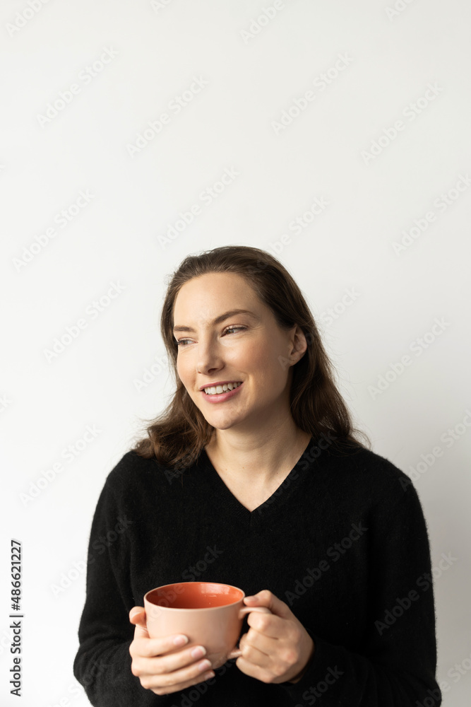 Portrait of young woman smiling with mug Portrait of young woman smiling with mug