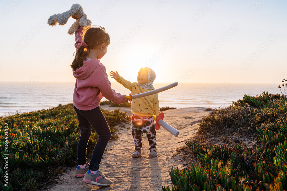Kids playing outdoors at sunset Stock Photo | Adobe Stock
