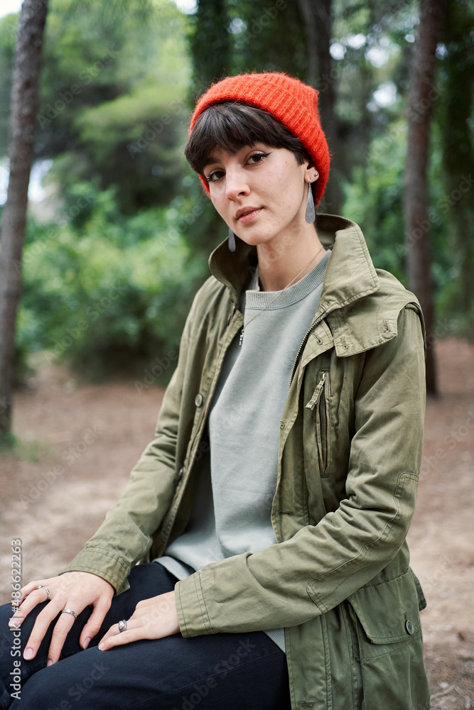 Female traveler standing in forest Female traveler standing in forest