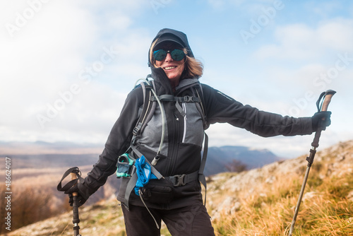 Smiling senior hiker posing for the camera