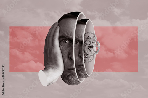 Head Of A Man With Gears Inside Against Sky photo