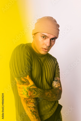 Young alternative man with urban outfit photo