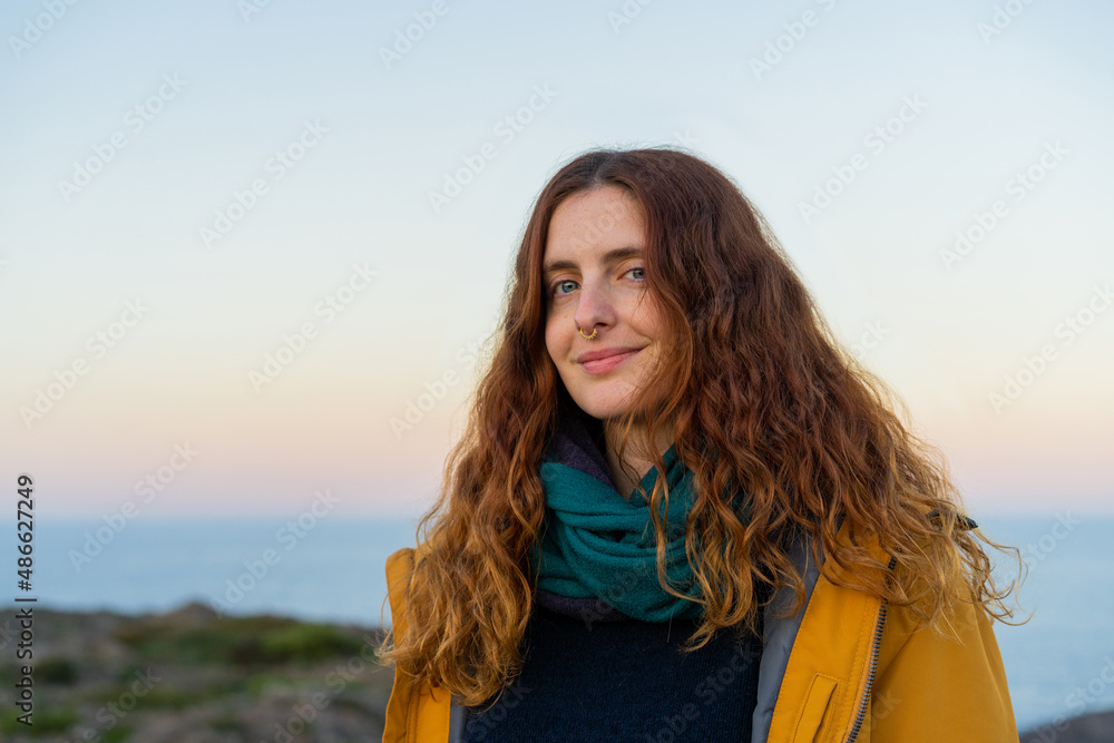 Portrait of smiley woman in nature at sunset Portrait of smiley woman in nature at sunset