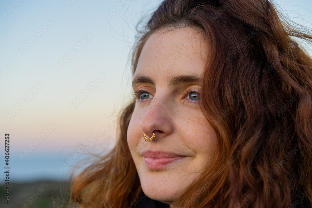 Portrait of smiley woman in nature at sunset Portrait of smiley woman in nature at sunset