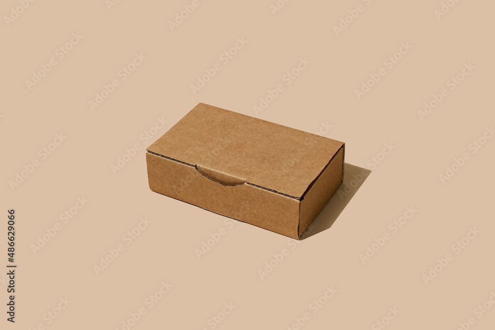 © Juan Moyano/Stocksy - closed rectangular corrugated fiberboard box