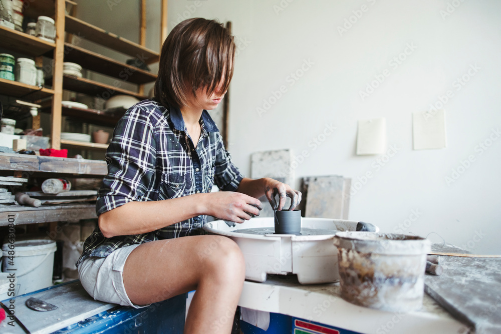 Woman artisan makes ceramic products. Woman artisan makes ceramic products.
