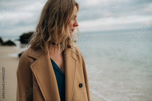 Moody portrait of a woman on winter beach