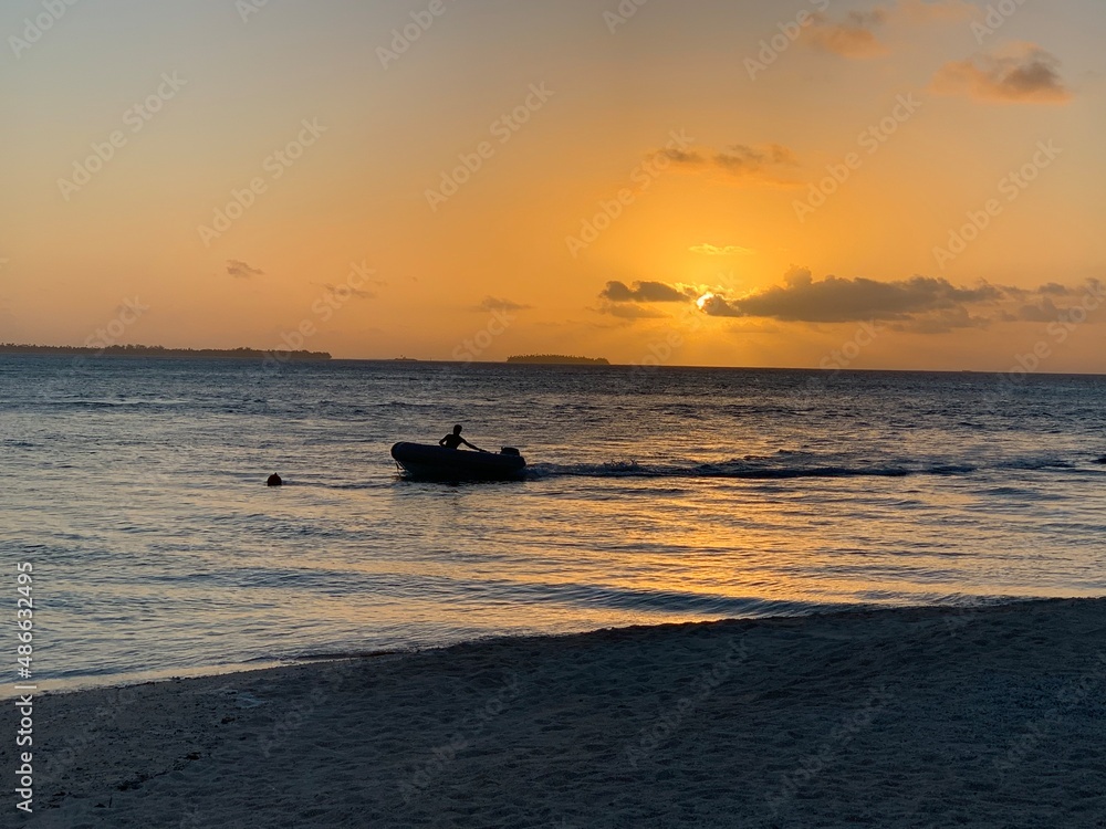 boat in the sunset in a Tahitian island 