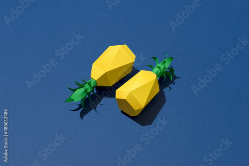 Two pineapple on a blue background