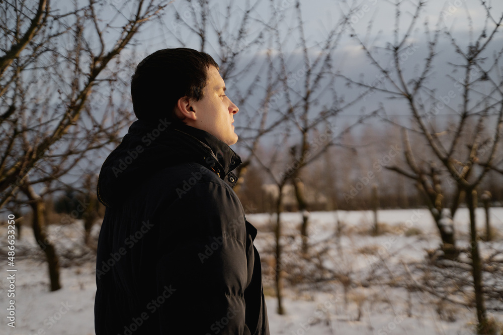 Man In Garden On Sunny Winter Day Man In Garden On Sunny Winter Day