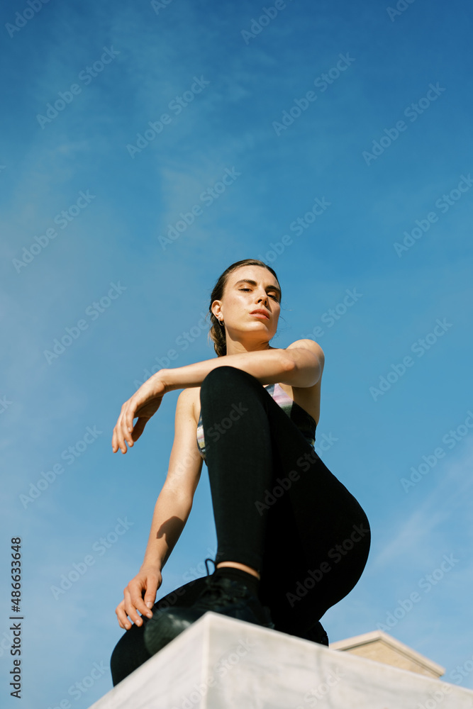 Slim woman in sportswear during workout Slim woman in sportswear during workout