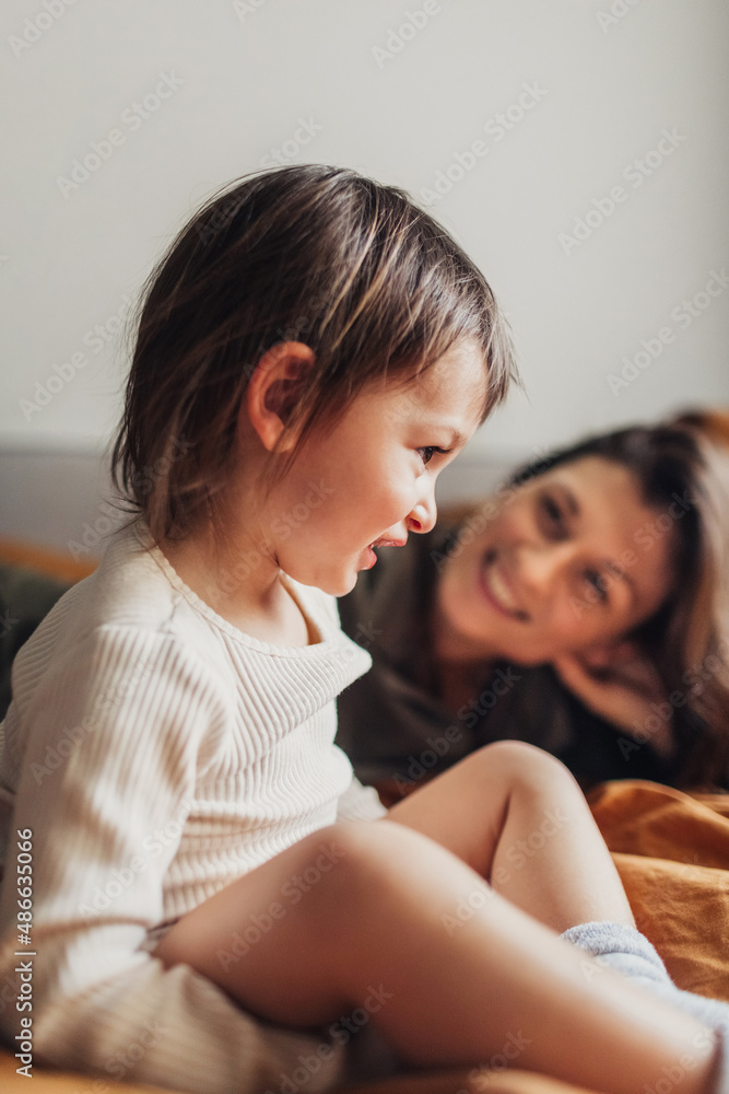 Woman and Baby Girl on Bed Woman and Baby Girl on Bed