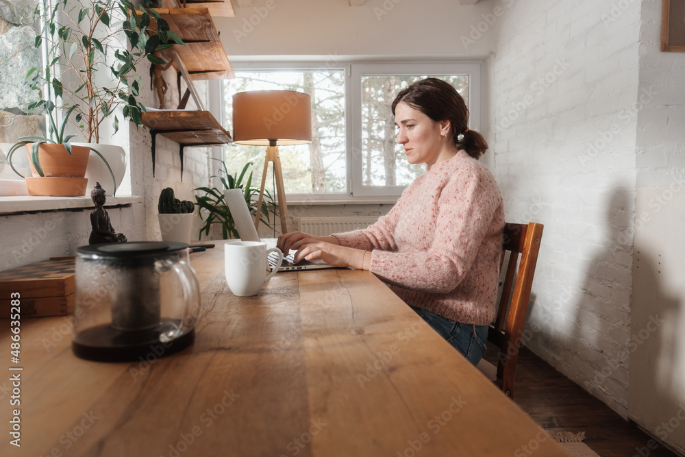 Woman Drinking Coffee While Working From Home Woman Drinking Coffee While Working From Home