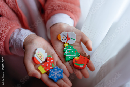 Christmas gift eraser in child's hand photo