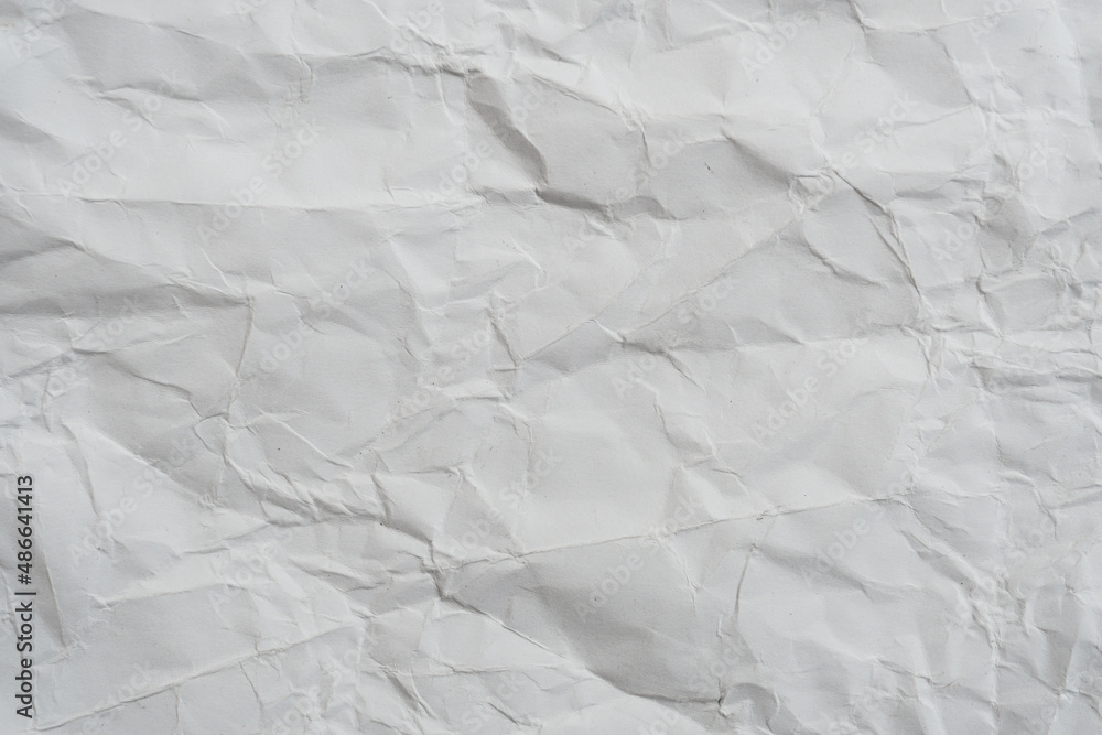 Fototapeta premium White crumpled paper texture background.