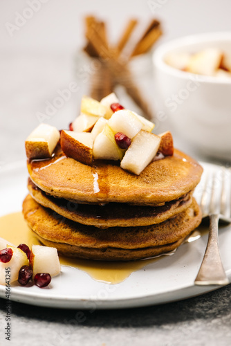 Gingerbread pancake stack with syrup photo