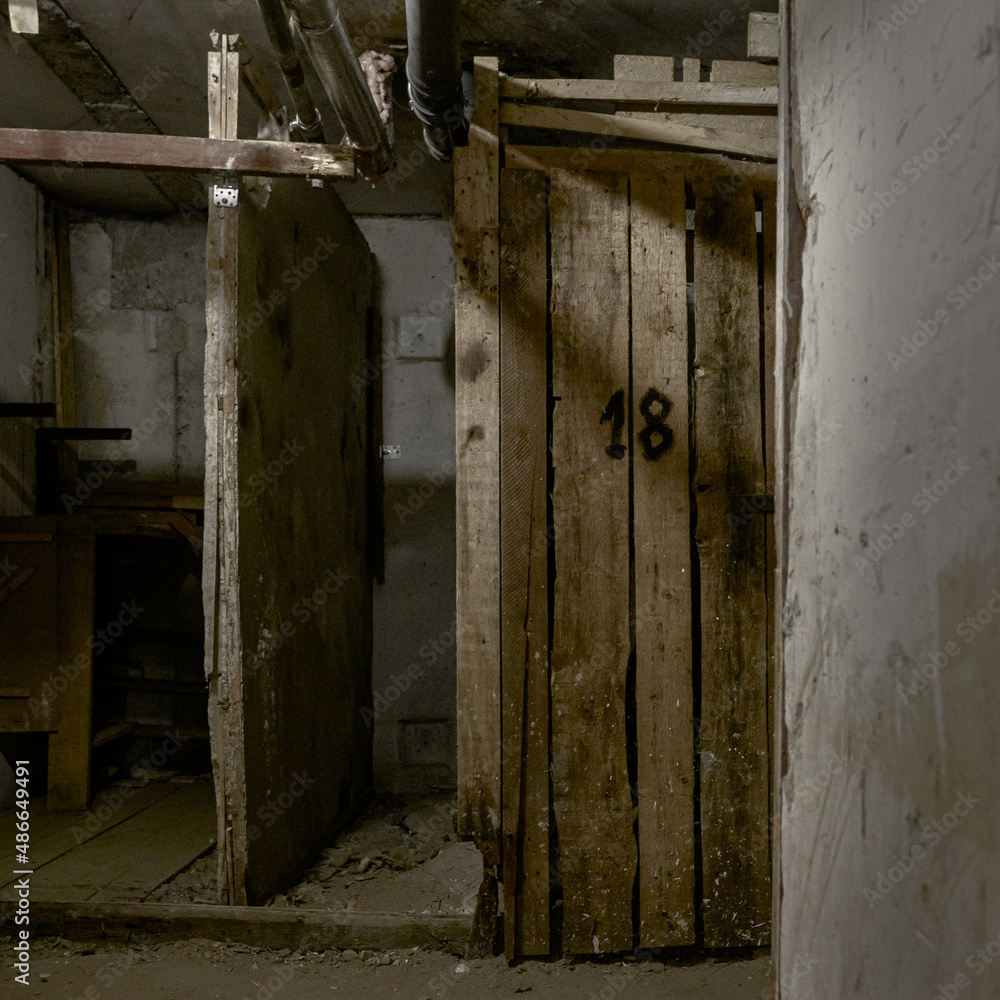 abandoned basement with electricity and sewer pipes