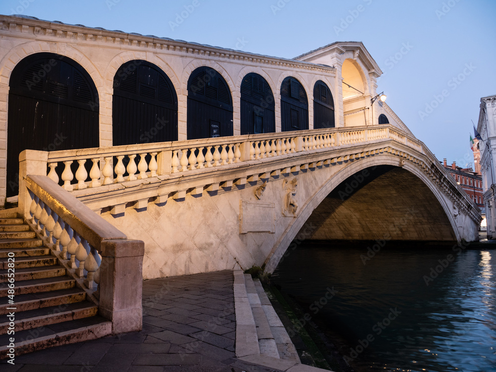 Rialto Bridge or Ponte di Rialto in Venice, Italy, Illuminated and Lonely in the Blue Hour of the Early Morning